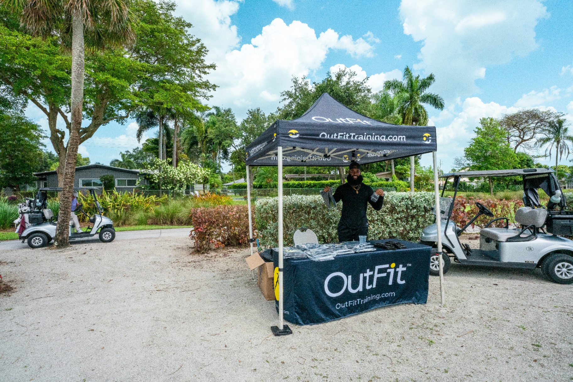 OutFit event booth set up at a golf course community event